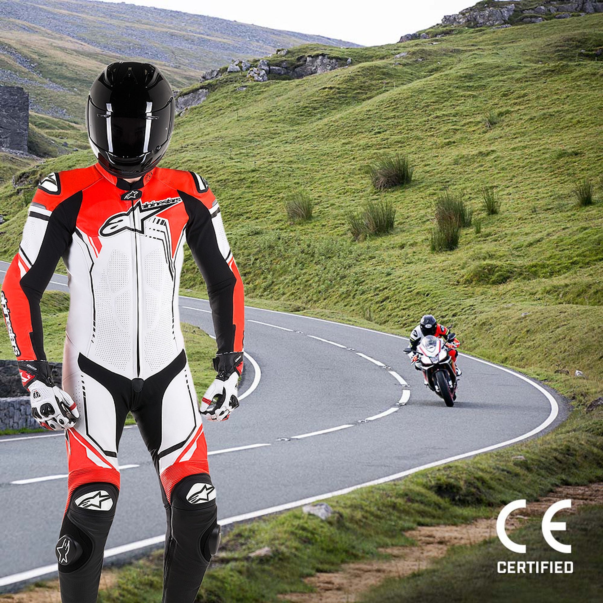 MRS motorcycle racing suit featuring red white and black alpinestars racing suit with helmet on winding road